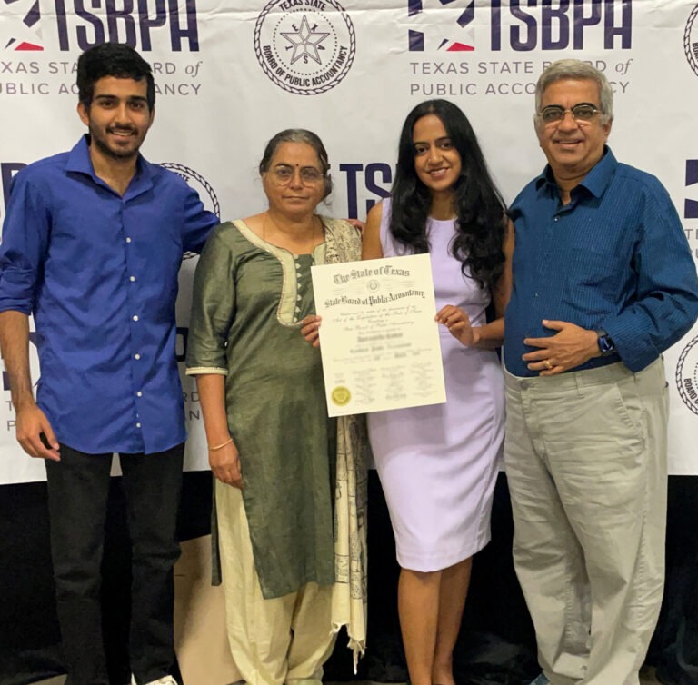 Kumar family posing at ceremony